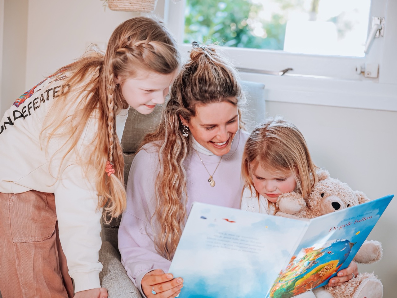 au pair reading with host kids